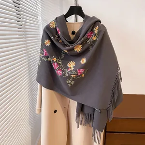 Deep grey cashmere-feel shawl with vibrant floral embroidery and fringe trim accents