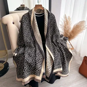 Close-up of geometric pattern scarf with fringe detail and double-sided cashmere texture