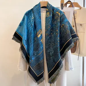 Artistic blue and gold abstract print cashmere shawl with fringes on white coat