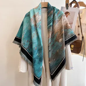 Detail of colorful cashmere feel scarf with abstract painting print and fringe edges