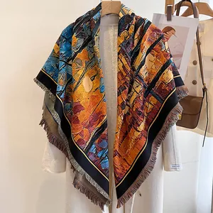 Macro detail of abstract oil painting cashmere shawl with elegant fringe and vibrant orange hue