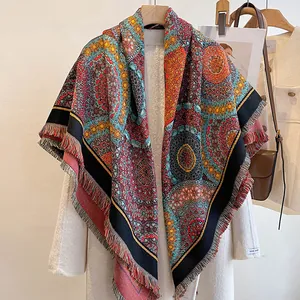 Detailed close-up of Bohemian mandala print shawl with fringe and handmade label