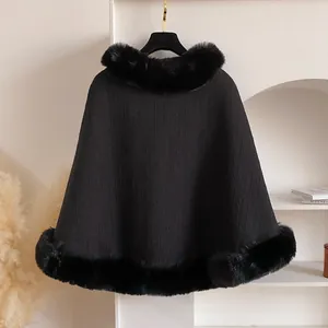 Close-up of black fleece-lined cheongsam cape with luxury faux fur collar and textured fabric