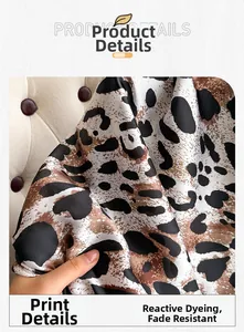 Detail of silk leopard print scarf showing reactive dyeing and smooth satin texture