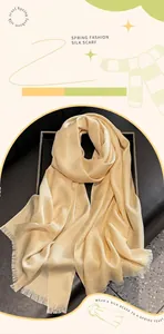 Macro view of champagne silk scarf with fine glitter finish and fringe edge