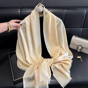 Elegant champagne silk shawl for women with geometric jacquard and shimmering gold silk