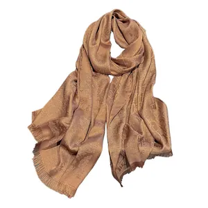 Elegant bronze silk shawl with classic logo jacquard pattern and fringe trim