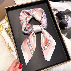 Detail of silk square scarf with geometric chain patterns on a stylish display