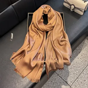 Elegant bronze silk cotton scarf with shimmering metallic threads and fringe trim details