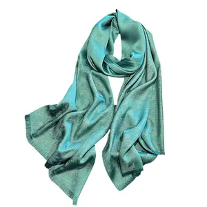 Elegant teal silk shawl with floral jacquard pattern and subtle gold thread shimmer