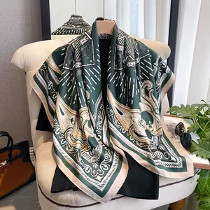 Detail of silk satin scarf showing dark green baroque patterns and geometric lines