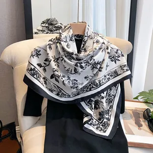 Elegant silk-like square scarf featuring vintage floral print and black and white contrast
