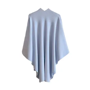 Elegant light blue knit poncho shawl with a V-neckline for women, soft drape style