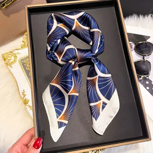 Artistic fan pattern silk scarf tied in a bow inside a premium black gift box set
