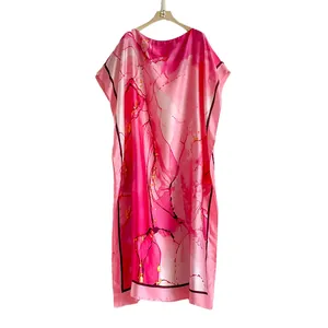 Pink abstract print kaftan dress with long loose fit and silky marble pattern texture