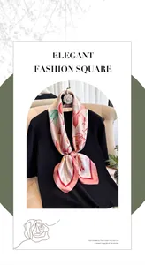 Close-up of a pink floral silk scarf knotted on a black top for a stylish luxury look