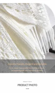 Détail de tissu tricoté au crochet blanc avec d'élégantes longues franges à glands