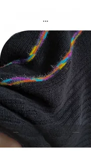 Close-up of bohemian knitted shawl featuring rainbow stripes and soft thermal fabric