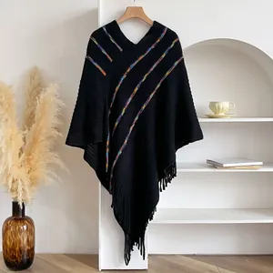 Bohemian knit poncho with colorful stripes, V-neck, and long fringe detail in black
