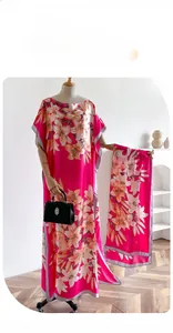 Detailed lily floral print on long rose pink imitation silk dress and matching scarf