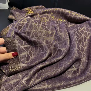 Deep purple silk-like shawl with golden metallic grid patterns and premium texture