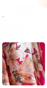 Detailed view of pink imitation silk fabric with elegant orange and white lily floral print