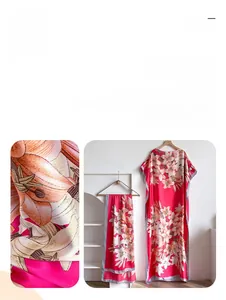Detail of red floral satin kaftan dress showing high-definition digital lily print quality