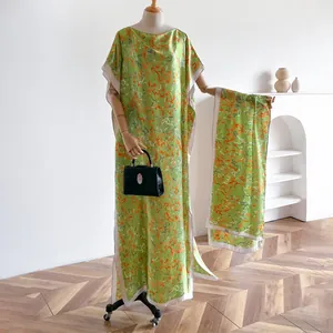Elegant grass green silk-like satin maxi dress with orange abstract prints and matching shawl