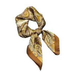 French style 70cm square silk scarf with golden paisley pattern in a tied ring display