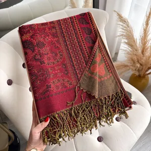 Detail view of burgundy paisley pashmina shawl with fringes in elegant gift box