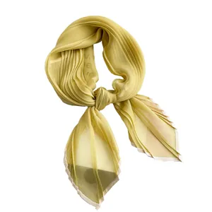 Pleated bright yellow faux silk scarf with elegant white contrast hem and artistic knot