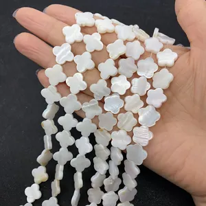 Macro shot of white mother of pearl shell flower beads for DIY jewelry making