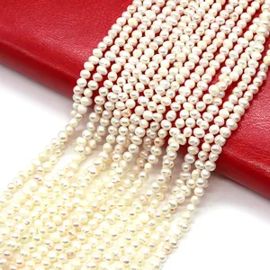 Natural white freshwater potato pearls on vibrant red leather for DIY jewelry making