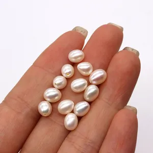 Macro shot of oval freshwater pearls with pink luster for DIY jewelry making