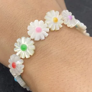 Daisy shaped beads bracelet with white petals and colorful centers for jewelry making