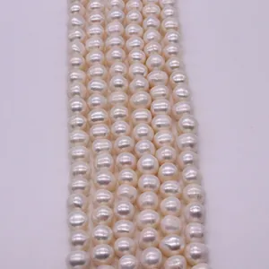 Strands of white semi-round freshwater pearls with natural luster for DIY jewelry making