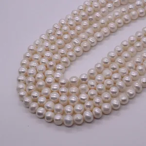 Detailed macro view of white 6-8mm high luster natural freshwater pearls for jewelry DIY
