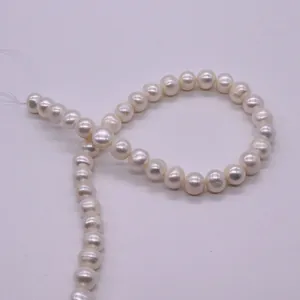 Close-up of high-quality white freshwater pearls with pre-drilled holes for DIY jewelry
