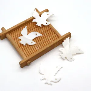 Ciondoli a forma di uccello in conchiglia bianca naturale per creazione gioielli DIY