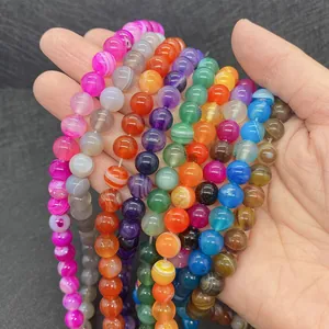 Detailed view of polished natural striped agate beads for DIY jewelry making
