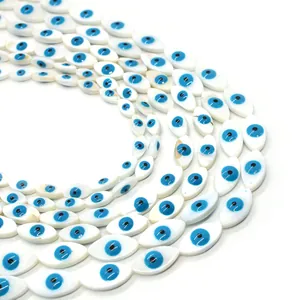 Natural shell evil eye marquise beads arranged in layered rows for DIY jewelry making