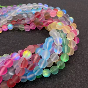 Macro shot of 6-10mm synthetic moonstone frosted beads with rainbow aurora finish