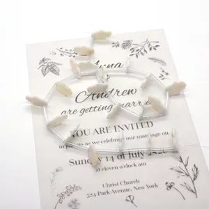 Natural freshwater palm shell beads strands on elegant vintage floral background