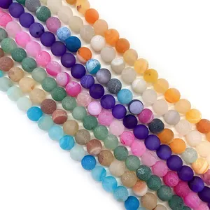 Macro view of matte natural agate beads with colorful stripes for DIY jewelry making
