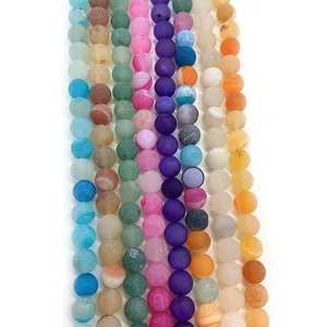 Macro shot of colorful matte striped agate natural stone loose beads for DIY jewelry