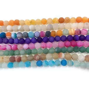 Macro view of colorful matte striped agate beads for DIY jewelry making accessories