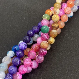 Macro shot of colorful dragon vein agate beads for DIY jewelry with weathered texture