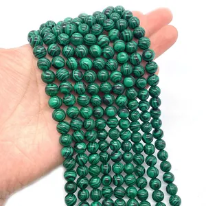 Perle tonde di malachite verde con trame striate uniche per creazione gioielli fai da te