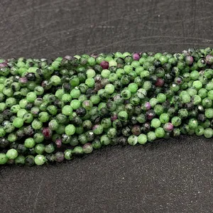 Detailed macro view of 2mm faceted Ruby in Zoisite beads for jewelry making