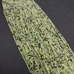 Macro shot of 2mm-4mm faceted natural green prehnite stone beads for DIY jewelry making